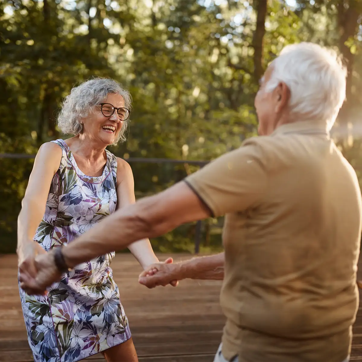 iStock-2242947311 About Infecctios Energy Senior couple smiling outdoors at night